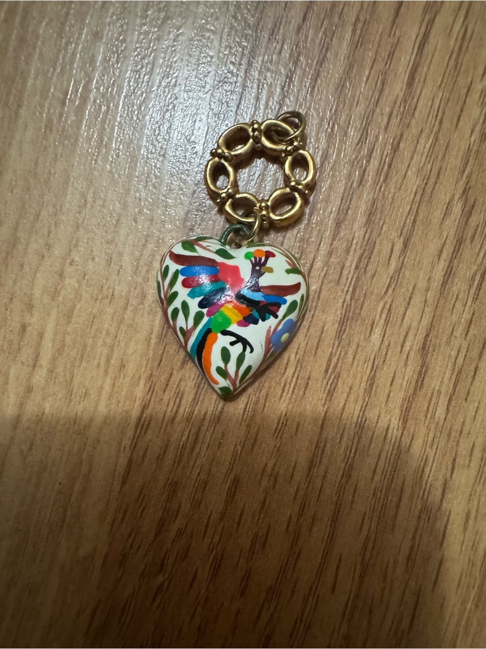 Heart pedant gold tone metal and white clay heart and colorful Mexican artwork